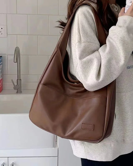 Large capacity tote bag, new black leather simple casual commuting women's bag, fashionable and versatile single shoulder bag