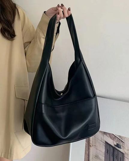 Large capacity tote bag, new black leather simple casual commuting women's bag, fashionable and versatile single shoulder bag
