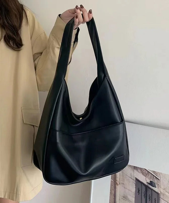 Large capacity tote bag, new black leather simple casual commuting women's bag, fashionable and versatile single shoulder bag