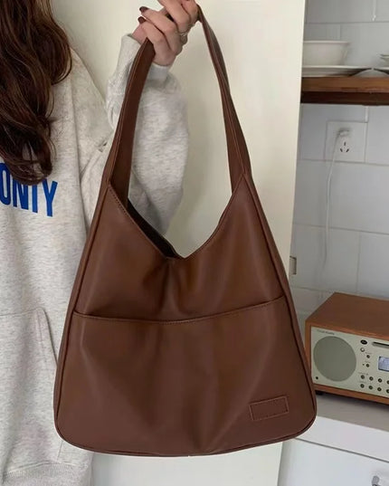 Large capacity tote bag, new black leather simple casual commuting women's bag, fashionable and versatile single shoulder bag