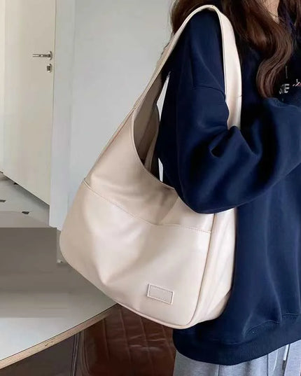 Large capacity tote bag, new black leather simple casual commuting women's bag, fashionable and versatile single shoulder bag