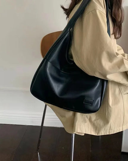 Large capacity tote bag, new black leather simple casual commuting women's bag, fashionable and versatile single shoulder bag